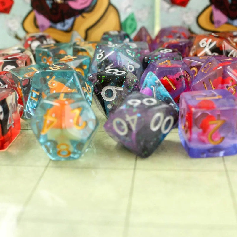 Collection of colorful polyhedral dice on a light surface with a blurred background